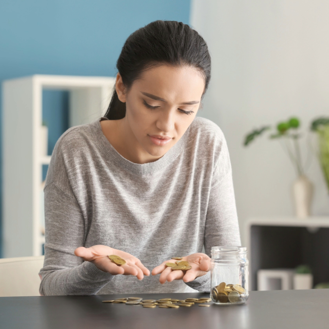 woman counting change