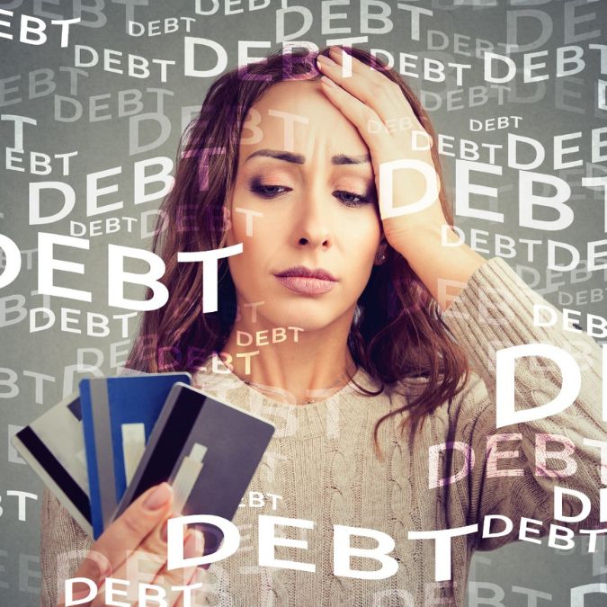 a woman worries about her debts