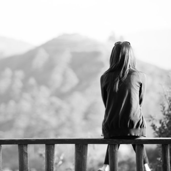 girl sitting alone