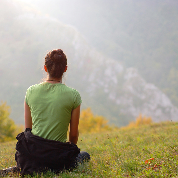 woman watching sunset