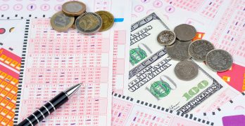 lottery tickets and different types of currency