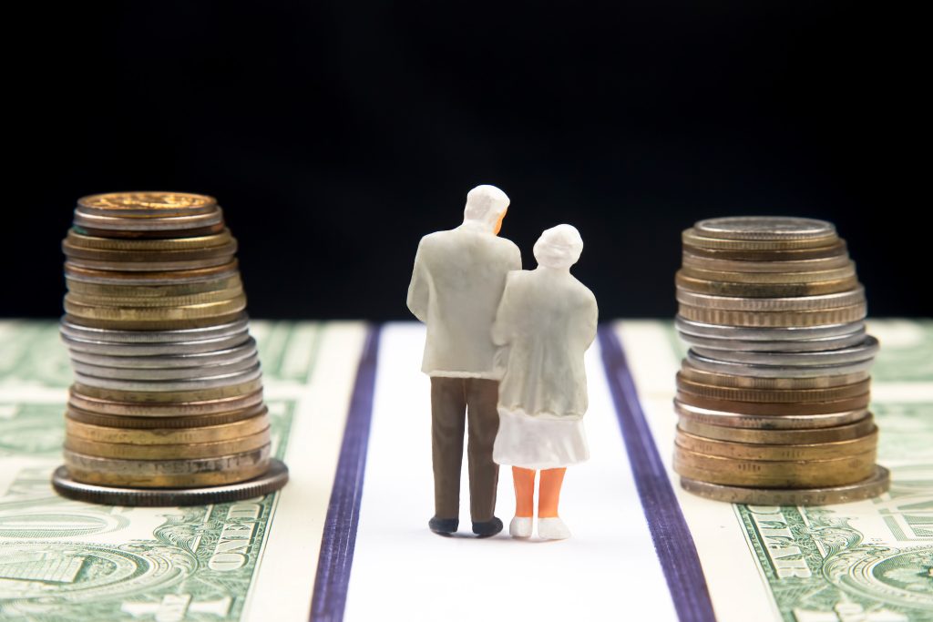 old couple next to money