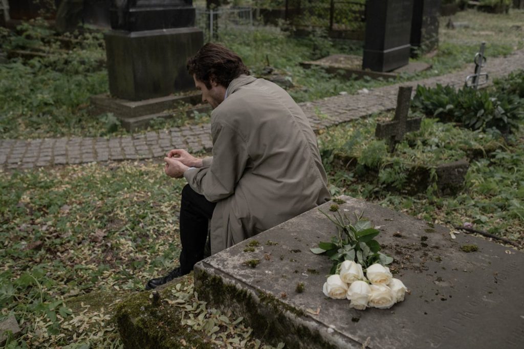man at grave